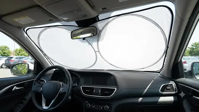 Car windshield sun shade to protect dashboard from heat