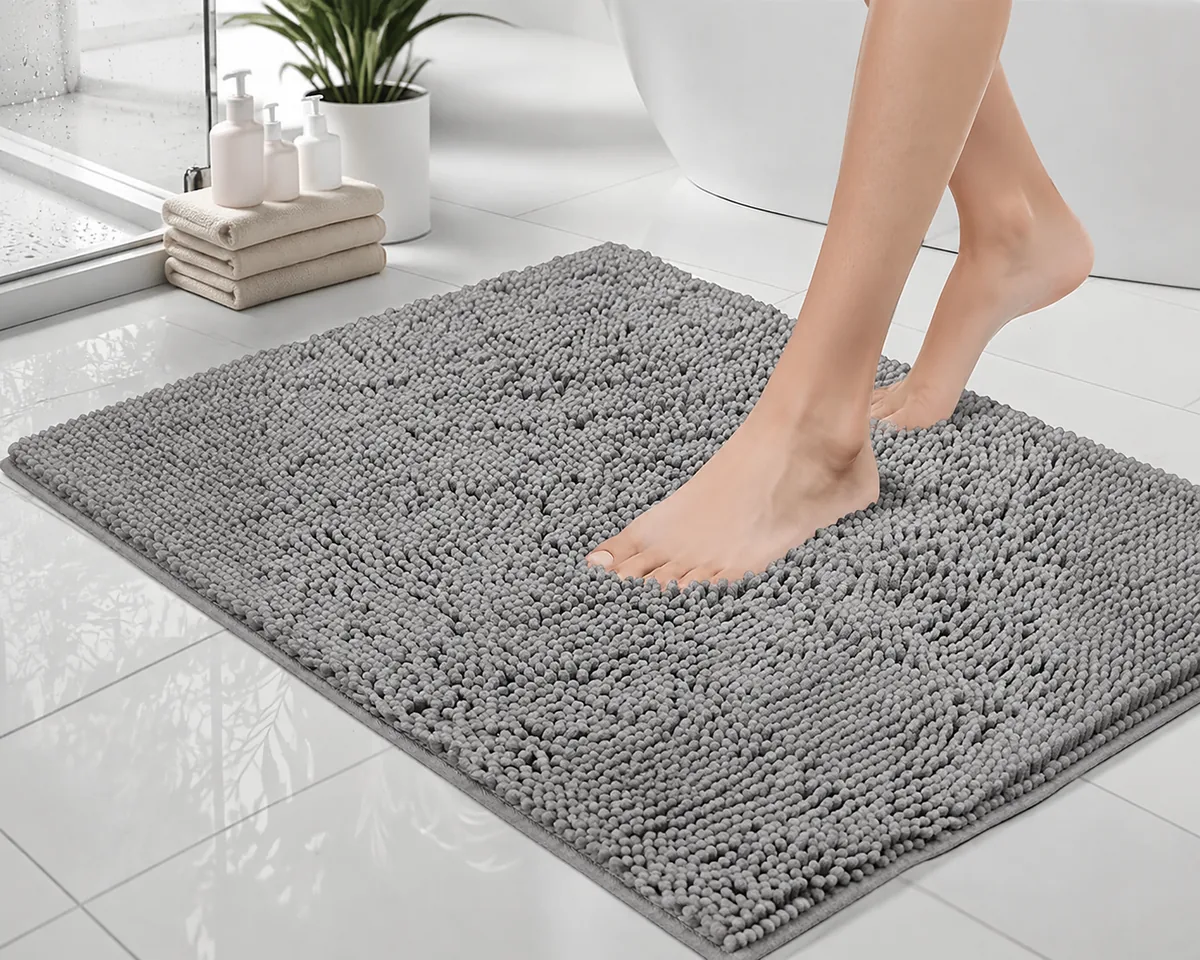 GORILLA GRIP Bath Rug Mat in gray, folded to show thick chenille pile and textured rubber backing.