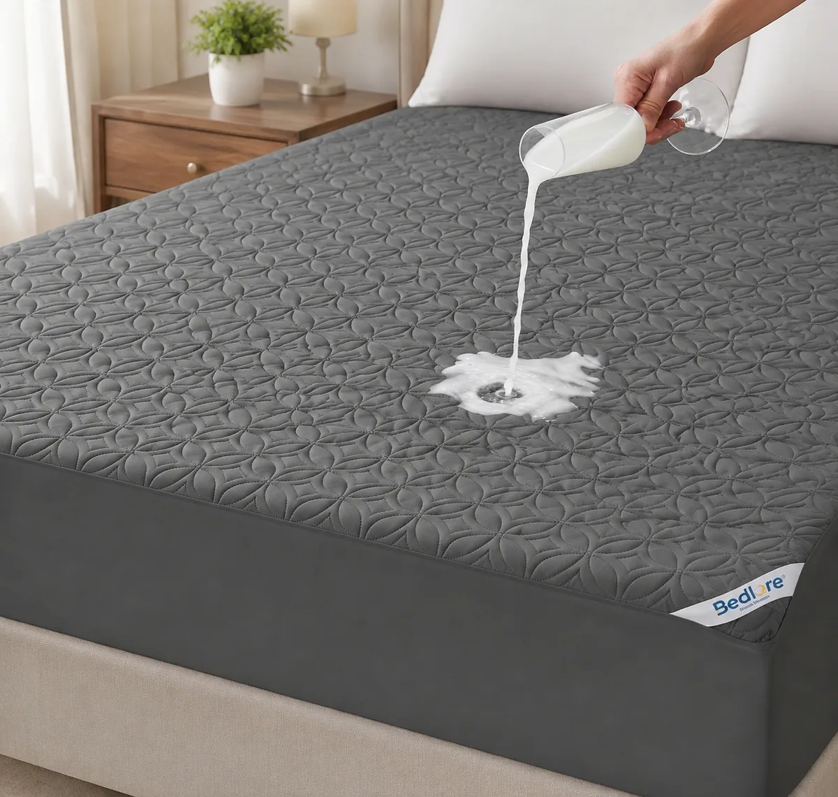 BEDLORE Waterproof Mattress Protector on a bed, showing quilted surface and deep pocket fit.