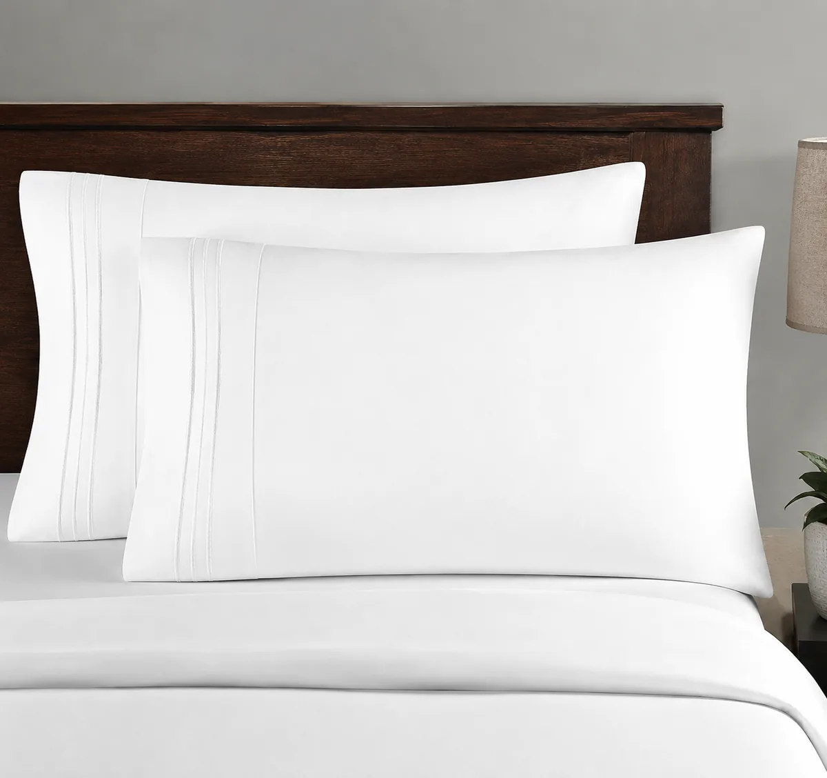 CGK Linens King Size Pillow Case Set in white, shown folded to display the soft double-brushed microfiber texture.